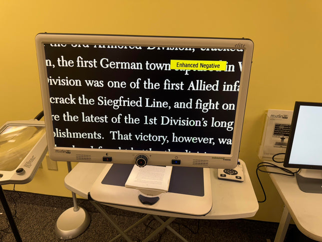 Used Merlin HD Elite Video Magnifier displaying enlarged text with Enhanced Negative mode for users with visual impairments.
