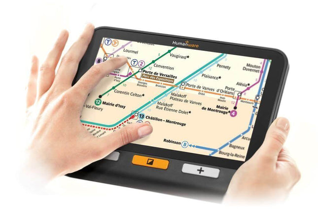 Hand using USED Explore 8 handheld electronic magnifier to view a map with touchscreen navigation features.