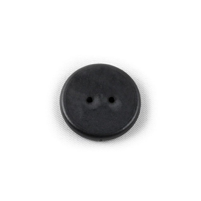 Close-up of a black WayTag 2-hole button, a wireless 2-hole button ideal for garment sewing and organization.