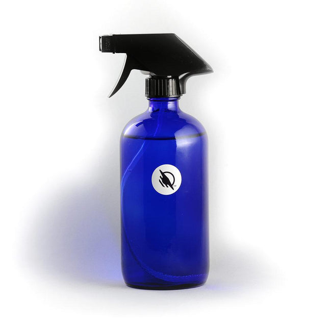 Wireless WayTag stickers on a blue spray bottle with a black trigger sprayer.
