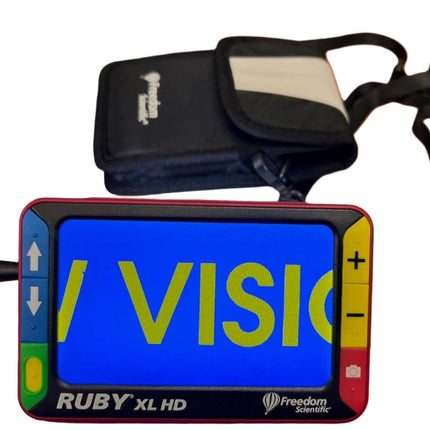 Used Ruby XL HD video magnifier displaying text with carrying case and controls, portable for easy use.